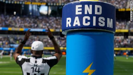An End Racism sign is shown on a goal post during an NFL football game between the Los Angeles Chargers and the Las Vegas Raiders in Inglewood, Calif., Sunday, Sept. 11, 2022. (AP Photo/Gregory Bull)