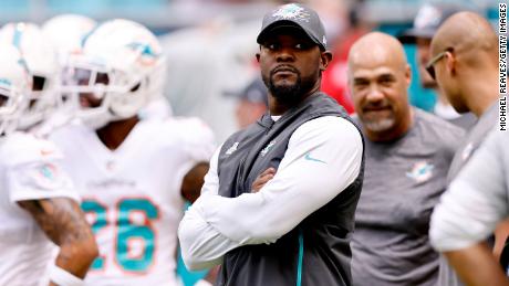 Brian Flores looks on before a game against the Atlanta Falcons at Hard Rock Stadium on October 24, 2021.