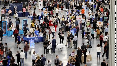 Job seekers visit booths during the Spring Job Fair at the Las Vegas Convention Center Friday, April 15, 2022.