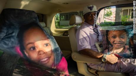 KG Wilson created a memorial for his granddaughter Aniya Allen in his SUV. The car seat cover of her face rests on the seat where she would ride with him. 