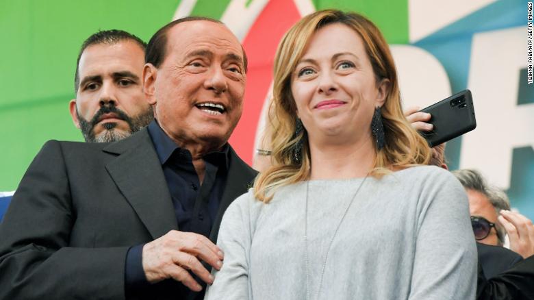Forza Italia&#39;s Silvio Berlusconi and Brothers of Italy&#39;s Giorgia Meloni acknowledge supporters at the end of a joint rally with Italy&#39;s far-right League party against the government on October 19, 2019 in Rome.