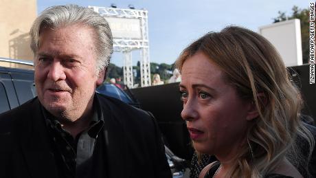 Former Trump White House chief strategist Steve Bannon (left) arrives with Giorgia Meloni to attend a convention of the Italian Brothers party in Rome September 22, 2018.
