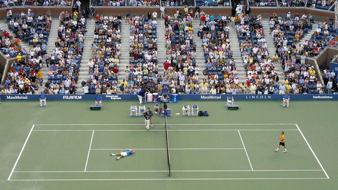 Federer celebrates after defeating Lleyton Hewitt to win his first US Open in 2004.