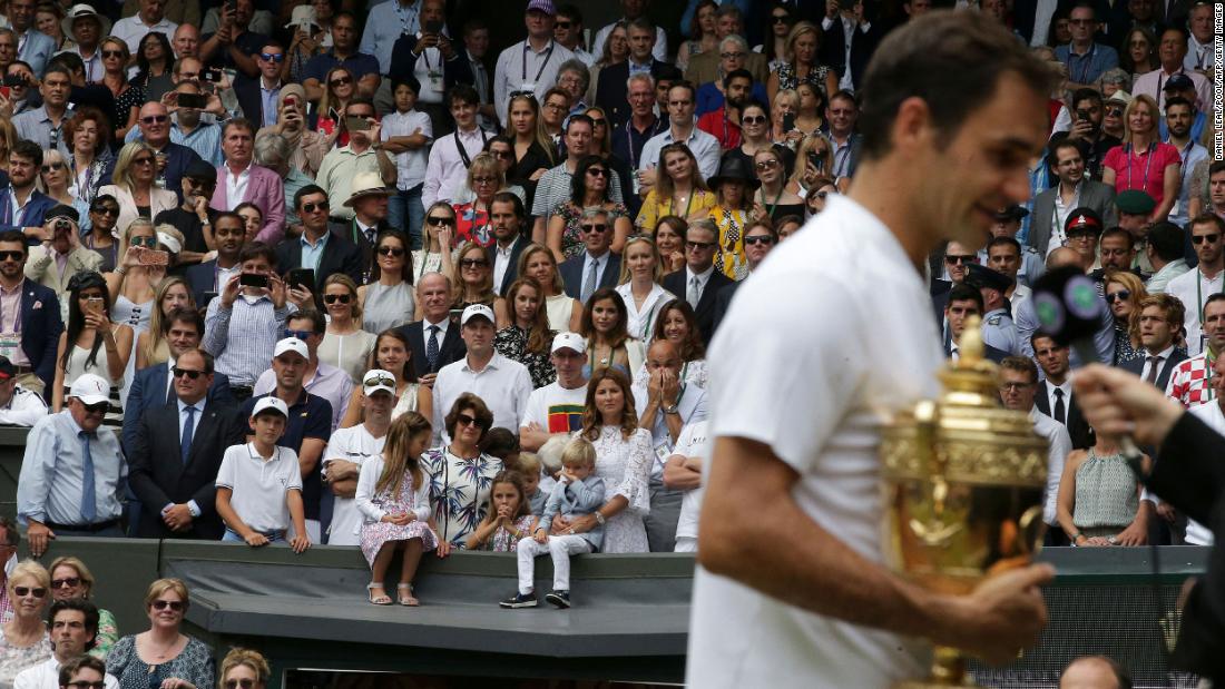 Federer is watched by his wife, Mirka, and their four children after winning Wimbledon in 2017. Federer has two sets of twins:  identical twin girls and fraternal twin boys.