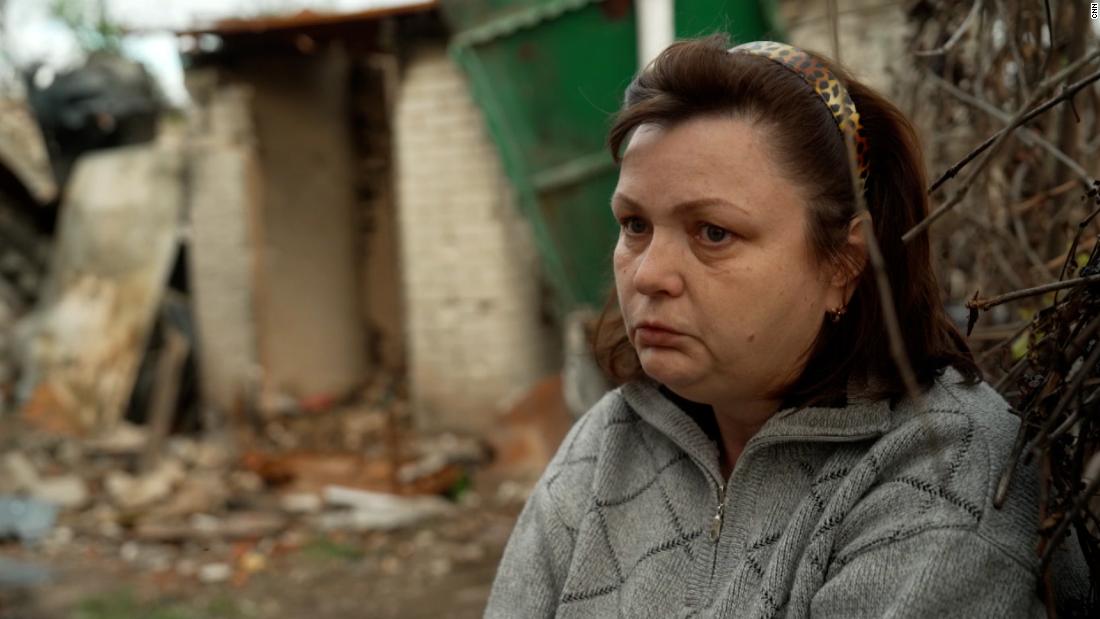 Woman reacts to returning to childhood home in ruins