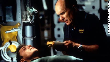 Robert Duvall, right, with Ron Eldard, commands a spacecraft trying to plant nuclear weapons on a comet in "Deep Impact"  (1998),