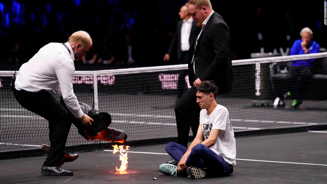 Protester sets arm on fire during Laver Cup tennis match ahead of Federer’s farewell