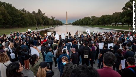 Hundreds of people attended a candlelight vigil at sunset  for Mahsa Amini at the Lincoln Memorial Reflecting Pool in Washington on September 23.