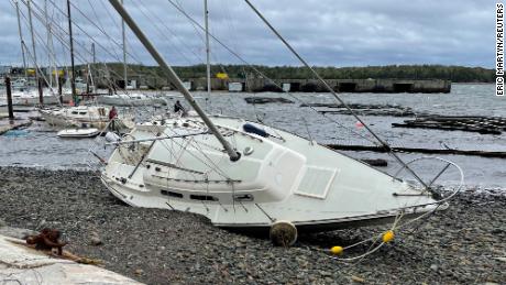 A sailboat lies washed up on shore following the passing of Hurricane Fiona, later downgraded to a post-tropical storm, in Shearwater, Nova Scotia, Canada September 24, 2022.  