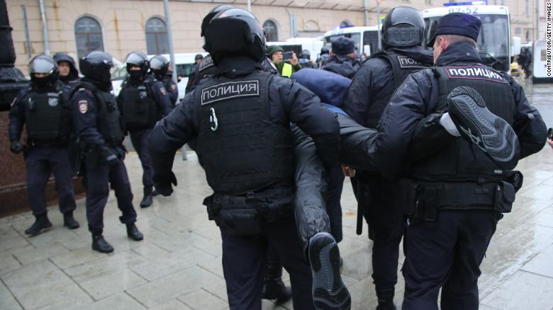 Police officers detain a protester during an anti-mobilization protest in Moscow, Russia, on September 24.