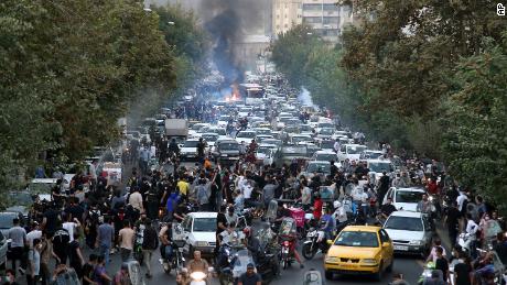 In this photo taken by an individual not employed by the Associated Press and obtained by the AP outside Iran, protesters chant slogans during a protest over the death of a woman who was detained by the morality police in downtown Tehran, Iran, on September 21, 2022. 