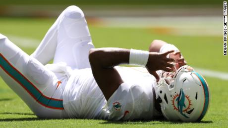 Tagovailoa lays on the turf during the second quarter of the game against the Buffalo Bills.