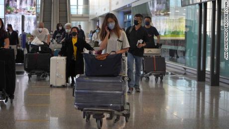 Passengers arriving at Hong Kong International Airport on Monday.