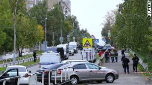 Police and emergency service workers near the scene of the school shooting in Izhevsk, Russia, on Monday.
