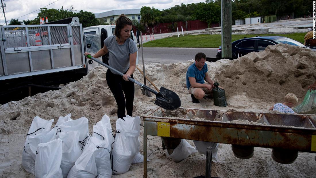 Sarah Peterson fills sandbags in Fort Myers Beach on September 24.