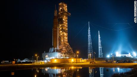 NASA&#39;s Space Launch System (SLS) rocket with the Orion spacecraft aboard is seen atop the mobile launcher as it is rolled back to the Vehicle Assembly Building from Launch Pad 39B, Tuesday, September 27, at NASA&#39;s Kennedy Space Center in Florida. 
