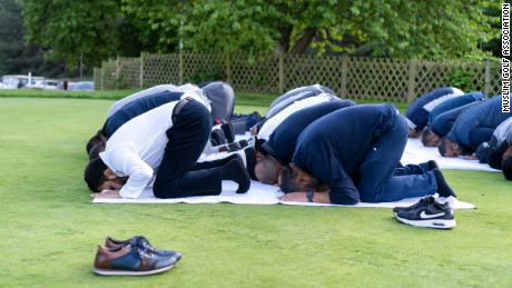 Play is paused to allow golfers to pray during an MGA event at Carden Park, Cheshire in May.