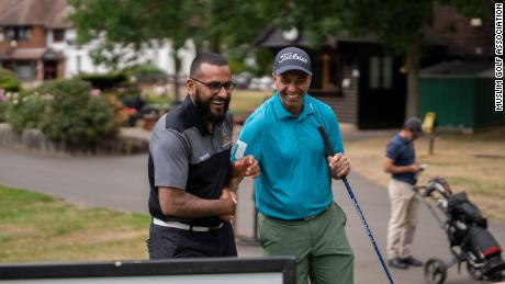 Amir Malik (L) is passionate about golf.
