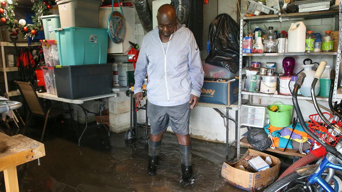Melvin Phillips stands in the flooded basement of his mobile home in Stuart, Florida, on Wednesday.