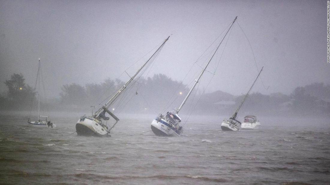 Sailboats anchored in Roberts Bay are blown around in Venice, Florida, on Wednesday.