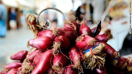 Red Onions at a street market in  Tropea town on September 09, 2019 in Tropea, Italy. Tropea is a small town on the east coast of Calabria, in southern Italy.