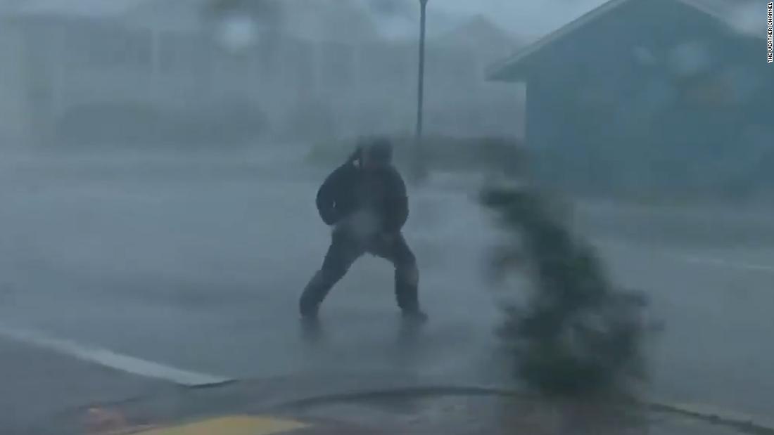 Watch: Reporter hit by tree branch while covering storm