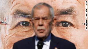 `Austrian President Alexander Van der Bellen presents election campaign posters for upcoming presidential elections in Vienna, Austria, September 23, 2022. REUTERS/Leonhard Foeger TPX IMAGES OF THE DAY 