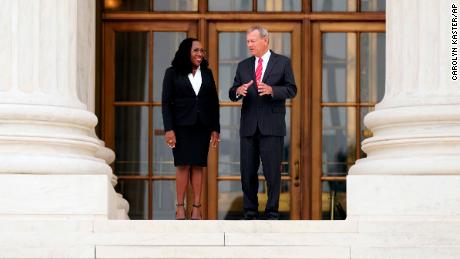Justice Ketanji Brown Jackson stands outside the Supreme Court with Chief Justice John Roberts following her formal investiture ceremony on Friday.