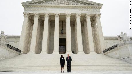 Justice Ketanji Brown Jackson and Chief Justice John Roberts stand in front of the Supreme Court on Friday.