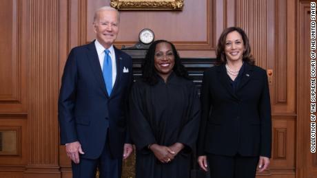 Justice Ketanji Brown Jackson poses with President Joe Biden and Vice President Kamala Harris on Friday.