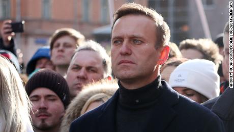 Alexey Navalny, Russian opposition leader, center, and his wife Yulia, right, walk with demonstrators during a rally in Moscow, Russia, on Saturday, Feb. 29, 2019. The rally marked five years since the assassination of politician Boris Nemtsov. 