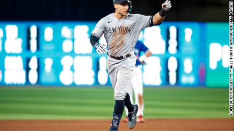 TORONTO, ON - SEPTEMBER 28:  Aaron Judge #99 of the New York Yankees runs the bases as he hits his 61st home run of the season in the seventh inning against the Toronto Blue Jays at Rogers Centre on September 28, 2022 in Toronto, Ontario, Canada. Judge has now tied Roger Maris for the American League record.  (Photo by Cole Burston/Getty Images)