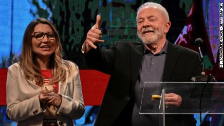 Former Brazilian President Luiz Inácio &quot;Lula&quot; da Silva gestures to supporters, with his wife, Rosangela da Silva, in Sao Paulo, Brazil, on October 2, 2022. 