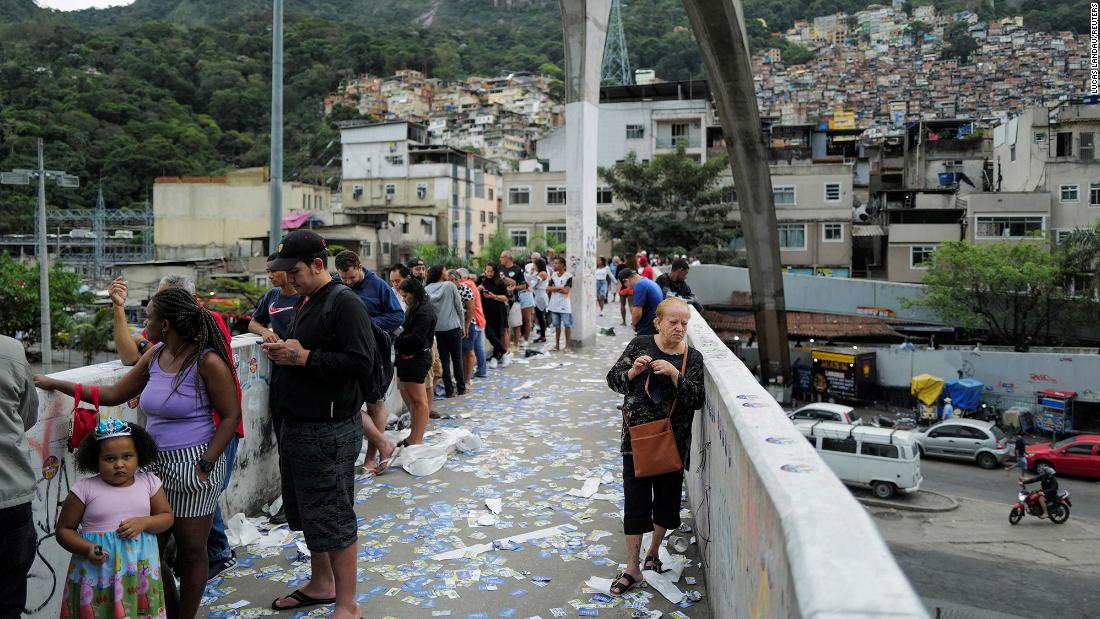 People stand in line to cast their votes in Rio de Janeiro on October 2.