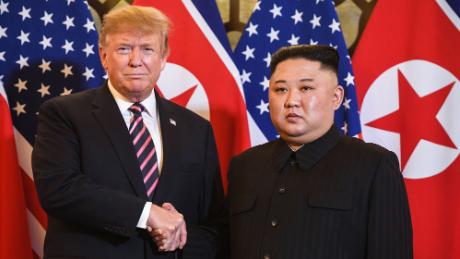 TOPSHOT - US President Donald Trump (L) shakes hands with North Korea&#39;s leader Kim Jong Un before a meeting at the Sofitel Legend Metropole hotel in Hanoi on February 27, 2019. (Photo by Saul LOEB / AFP) (Photo by SAUL LOEB/AFP via Getty Images)