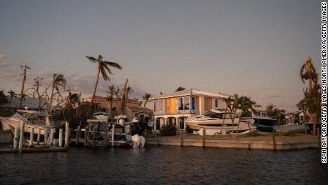 Boats rest on a canal property on Sanibel Island after Hurricane Ian.