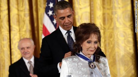 Then President Barack Obama awards the Presidential Medal of Freedom to Loretta Lynn in 2013.