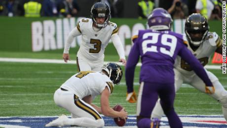 Lutz attempts a 61-yard field goal against the Vikings.