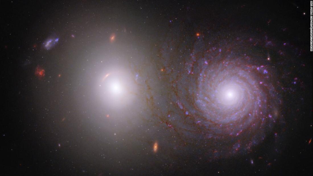 The James Webb Space Telescope and Hubble Space Telescope contributed to this image of galactic pair VV 191. Webb observed the brighter elliptical galaxy (left) and spiral galaxy (right) in near-infrared light, and Hubble collected data in visible and ultraviolet light.
