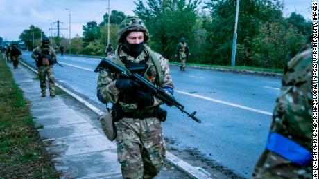 KUPIANSK, UKRAINE - SEPTEMBER 28: Ukrainian soldiers patrols the streets of the city on September 28, 2022 in Kupiansk, Ukraine. Kupiansk is a city in Kharkiv Oblast, located on the border with Luhansk Oblast. Before the full-scale Russian invasion, about thirty thousand residents lived there. Kupiansk was under Russian occupation for half a year. On September 10, Ukrainian armed forces liberated the city, however, there is still fighting on its outskirts. (Photo by Ivan Chernichkin/Zaborona/Global Images Ukraine via Getty Images)