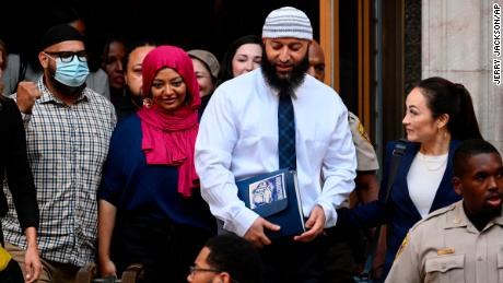 Adnan Syed, center right, leaves the courthouse after a hearing on Monday, Sept. 19, 2022, in Baltimore.