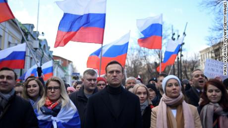 TOPSHOT - Russian opposition leader Alexei Navalny, his wife Yulia, opposition politician Lyubov Sobol and other demonstrators march in memory of murdered Kremlin critic Boris Nemtsov in downtown Moscow on February 29, 2020. (Photo by Kirill KUDRYAVTSEV / AFP) (Photo by KIRILL KUDRYAVTSEV/AFP via Getty Images)