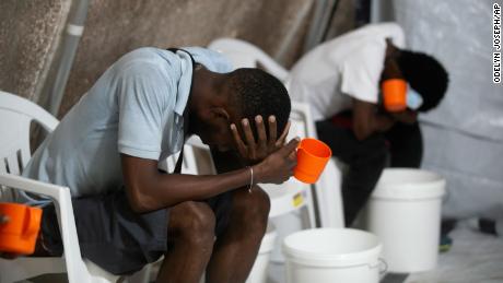 People suffering symptoms of cholera pictured on October 7.