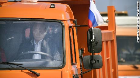Putin drives a Kamaz truck during a ceremony opening the bridge on May 15, 2018. 