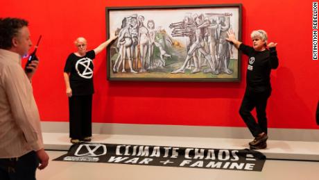 Extinction Rebellion said no art was harmed in the incident, which saw protesters glue themselves to a Picasso painting.