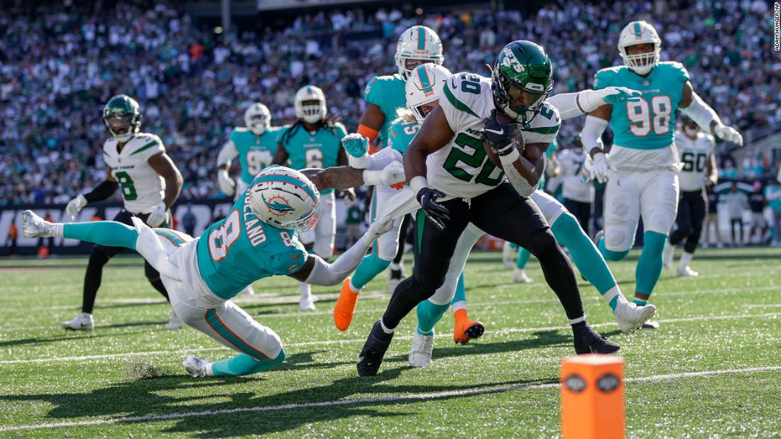 New York Jets running back Breece Hall carries the ball down to the one-yard line against the Miami Dolphins during the fourth quarter. Hall rushed for a touchdown in the Jets&#39; 40-17 demolishing of the Dolphins. His TD was one of the Jets&#39; four rushing touchdowns as they dominated Miami on the ground. 