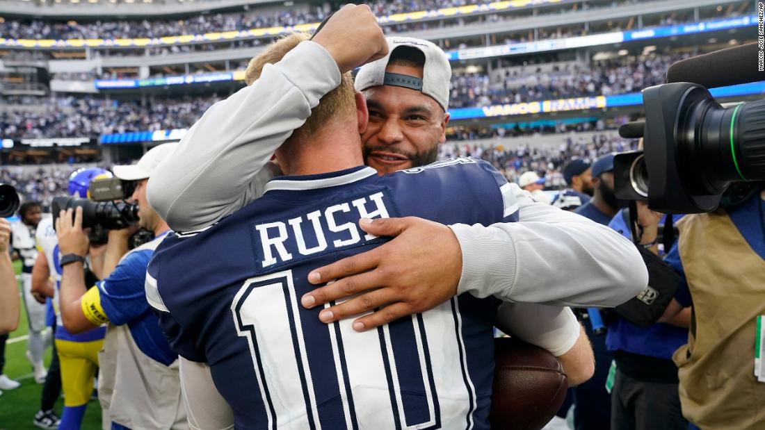 Dallas Cowboys quarterback Cooper Rush celebrates with Dak Prescott after the team&#39;s 22-10 win against the Los Angeles Rams. Rush stepped in for starting quarterback Prescott in Week 2 after Prescott suffered a hand injury. Since then, the Cowboys have won four straight games. 