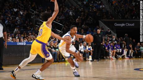 Jordan Poole drives to the basket during a preseason game against the Los Angeles Lakers.