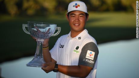 Kim poses with the Shriners Children&#39;s Open trophy.