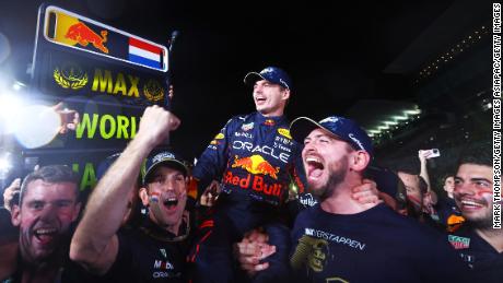 Max Verstappen is held aloft as his Red Bull team celebrates winning the drivers&#39; championship.